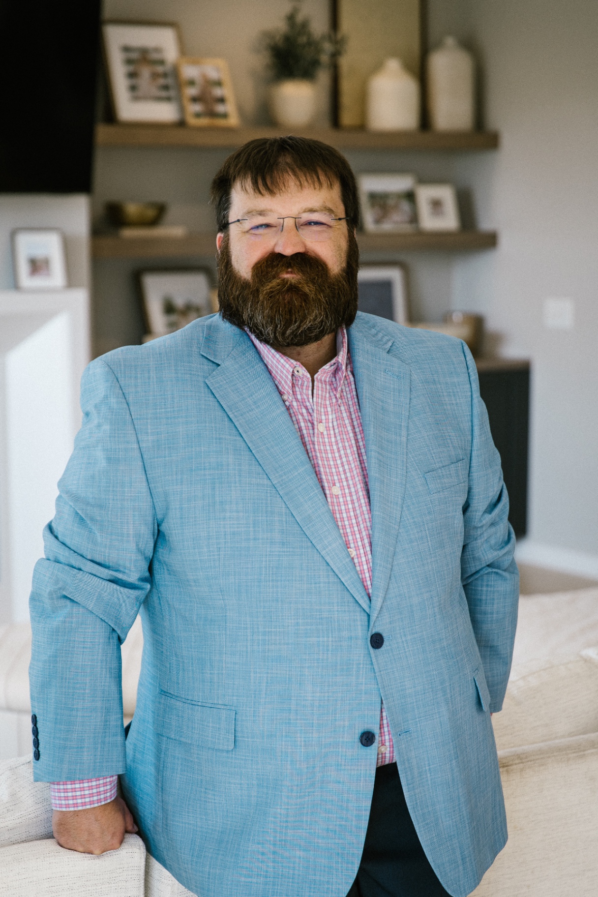 Bill Hill smiling in a Central Minnesota home